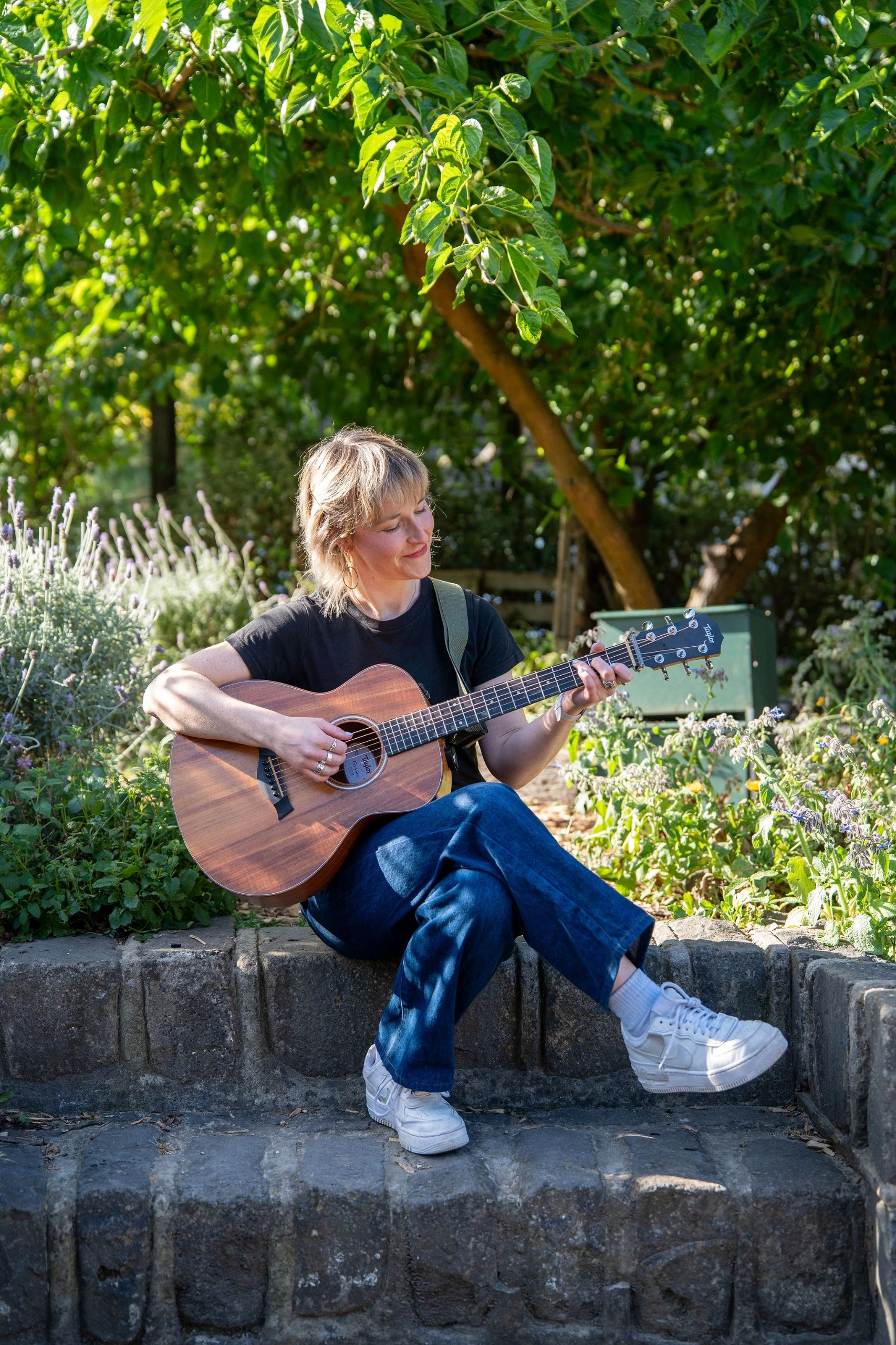 Rhian playing guitar